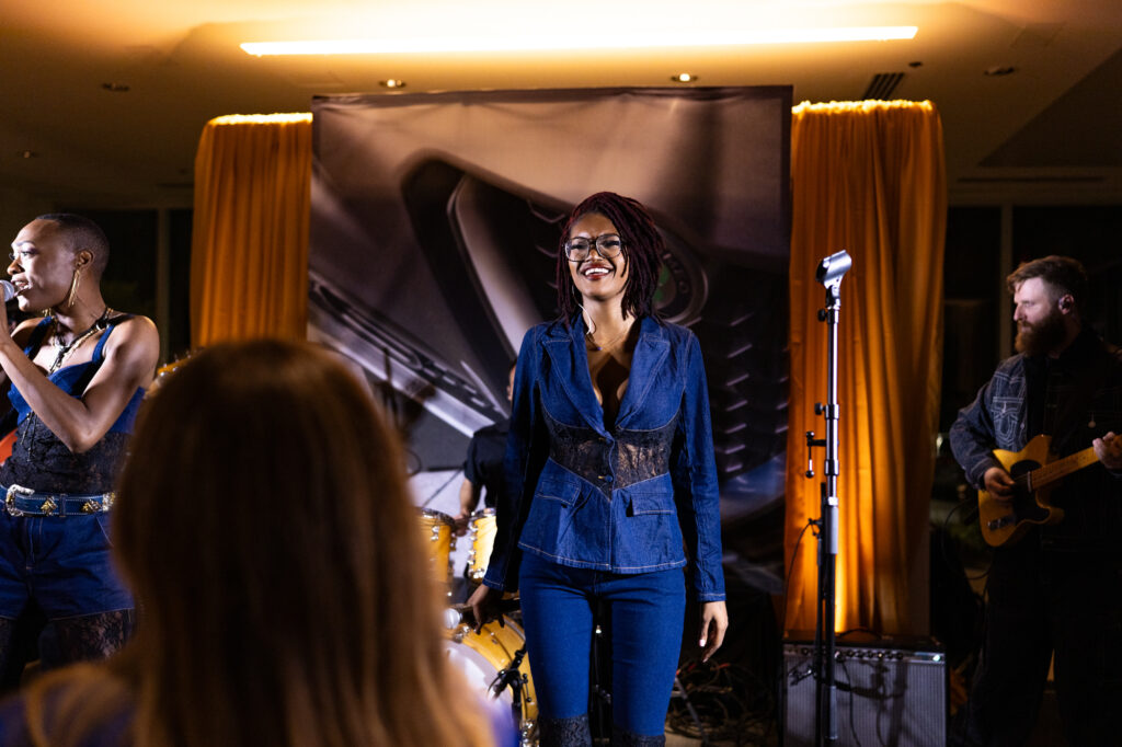 Live performance by Magnolia Rising during the Modern Luxury Nashville one-year anniversary event at Carlock Motors.