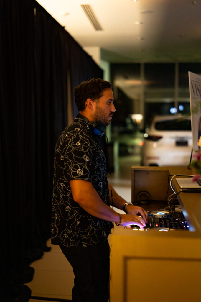 DJ Nick from Second Song performing at the Modern Luxury Nashville one-year anniversary event inside Carlock Motors.