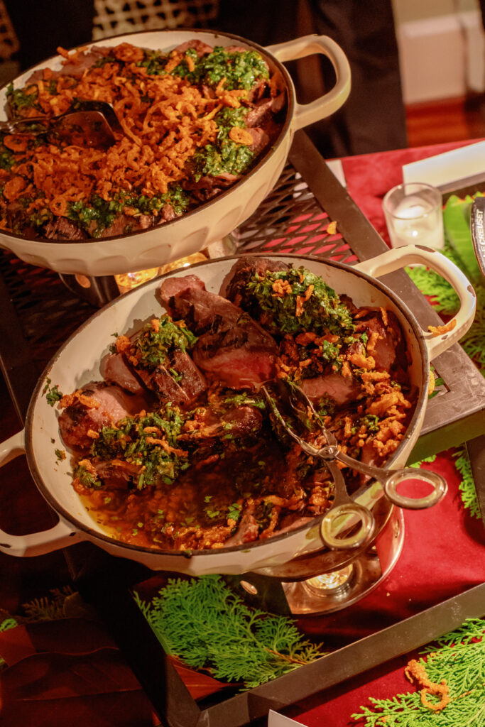 Wedding catering display with plated entrees and serving dishes at Nashville Symphony reception